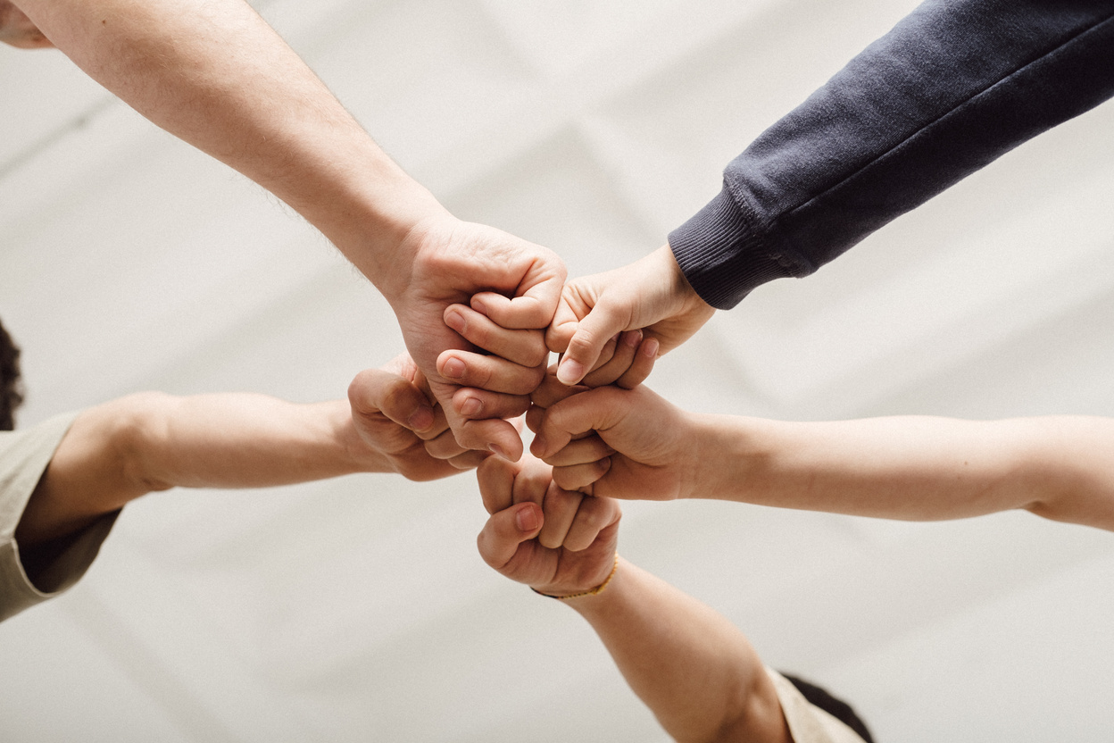 People Fist Bumping